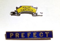 House Captain and Prefect's Badge House Captain's badge and prefect's badge. Property of Robert Holbrook